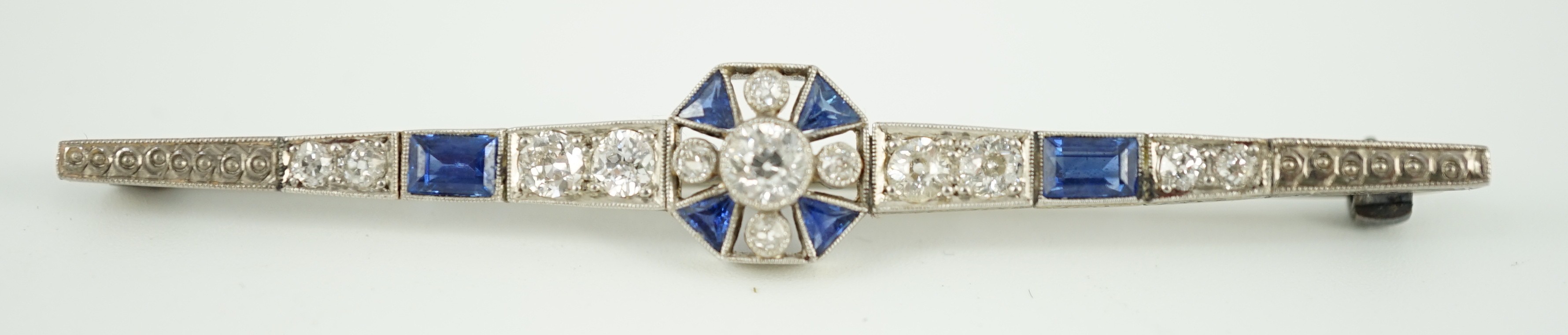 A 1920's/1930's white gold, sapphire and diamond cluster set bar brooch